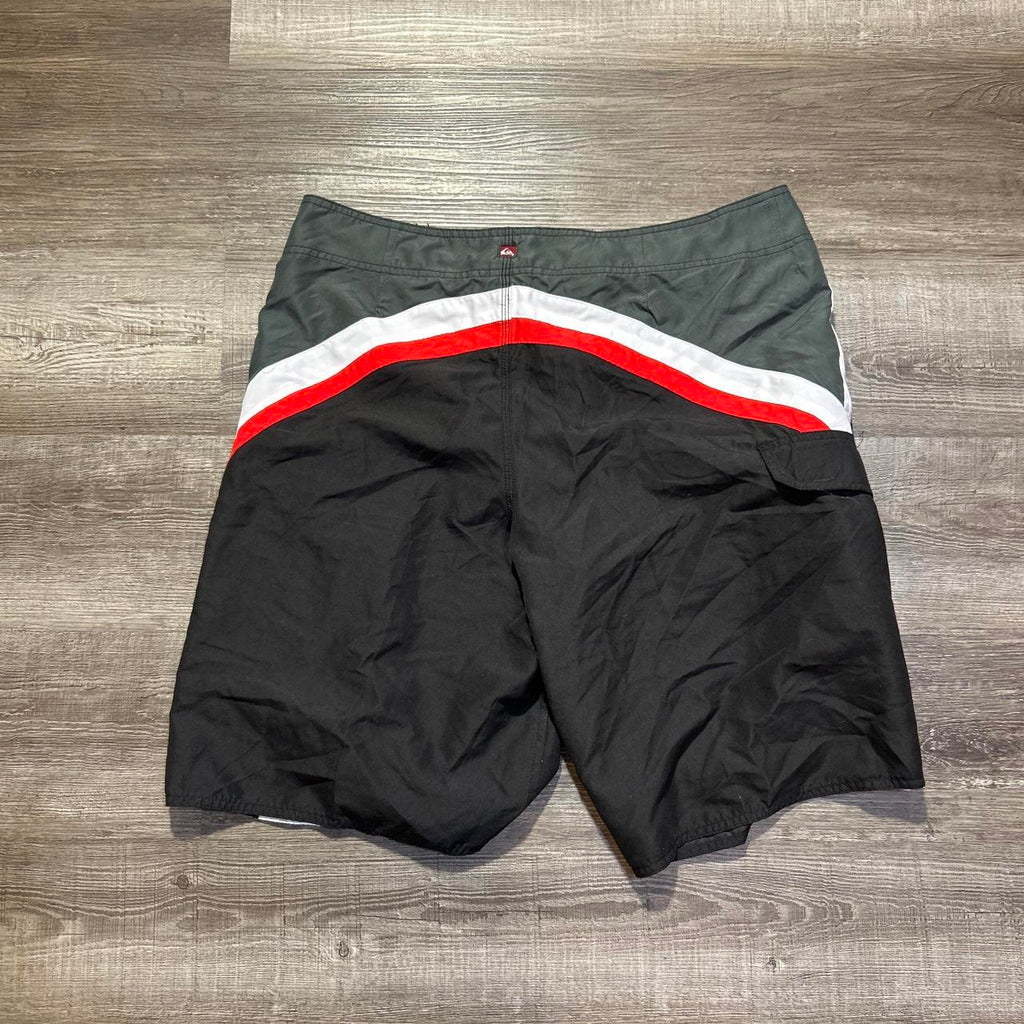 Y2K Quiksilver black swim shorts with white/red side, view 3