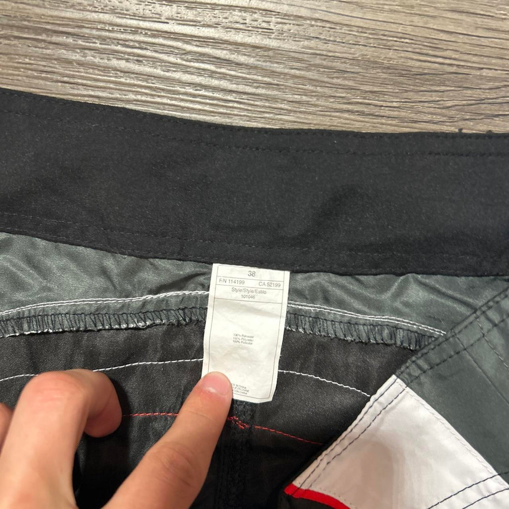 Y2K Quiksilver black swim shorts with white/red side, view 2